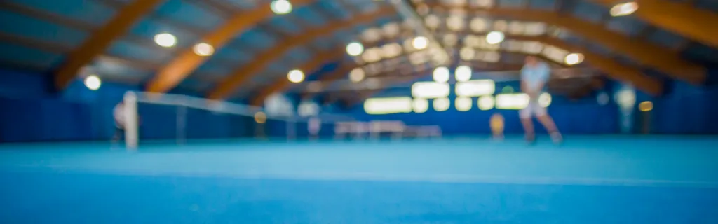 Indoor tennis facility with covered courts for year-round play