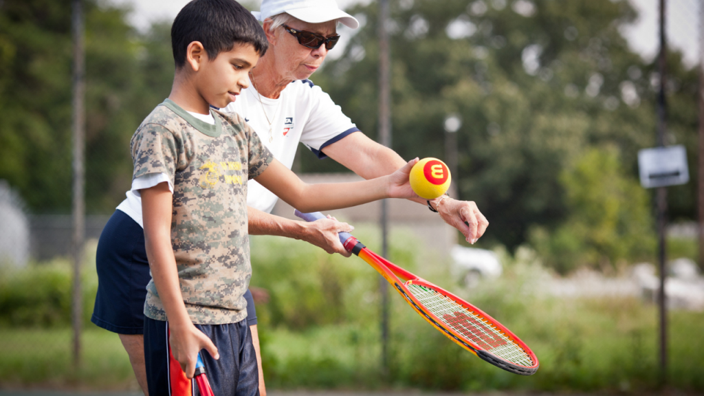tennis instruction with age appropriate equipment