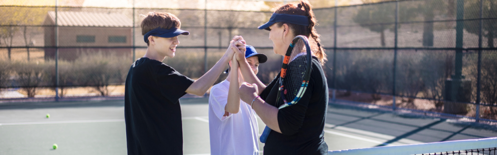 tennis instructor with students